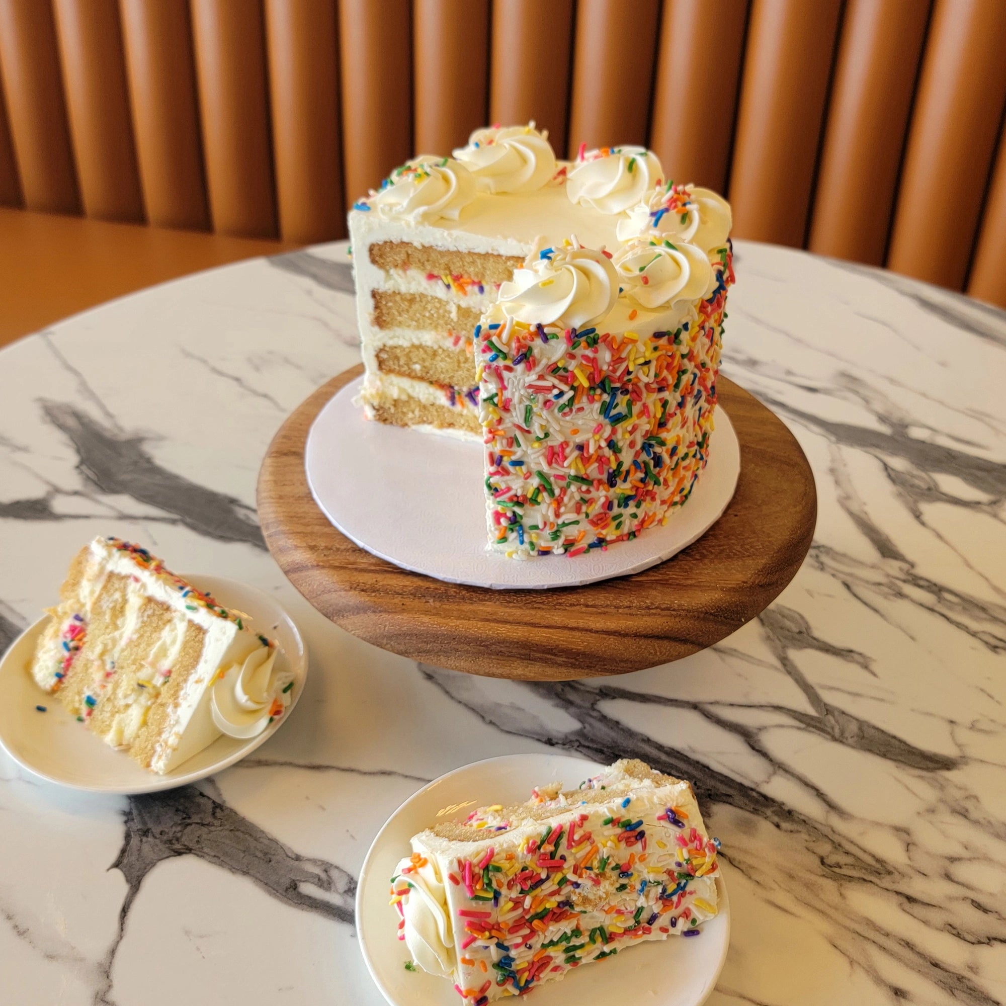 Classic Birthday Cake with white buttercream and colorful sprinkles