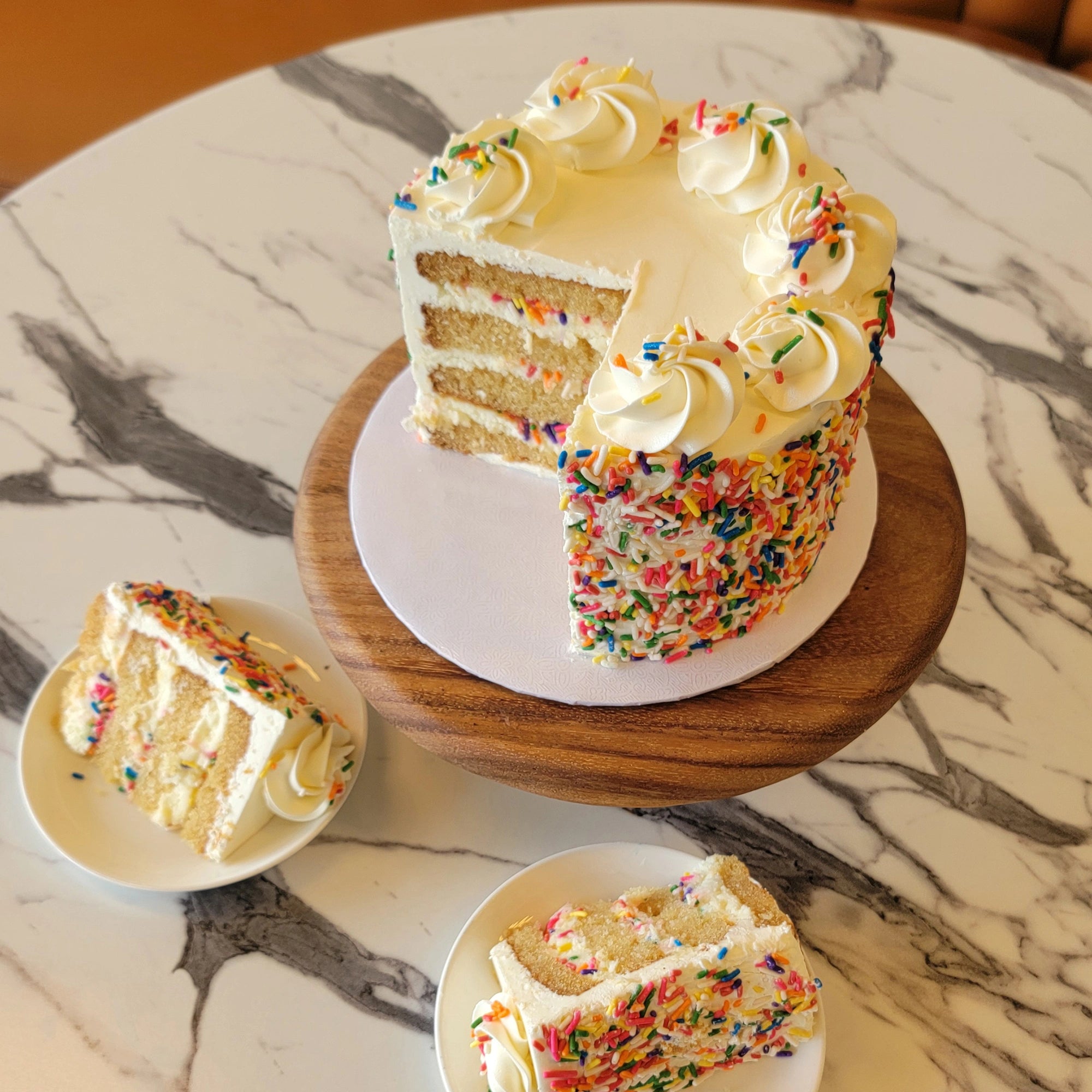 Classic Birthday Cake with white buttercream and colorful sprinkles