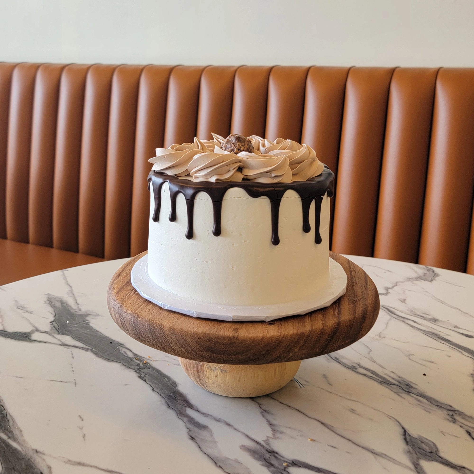 6-inch chocolate hazelnut cake topped with Ferrero Rocher and buttercream